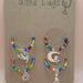 Rainbow beads with cats charms in a pack of 4