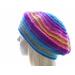 A color-changing yarn creates bands of bright color in blue, pink, orange, gold and purple in an elegant beret.  This view shows the crown and the wide brim.