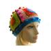Mannequin wears a one-of-a-kind 5-Square Beanie created with scrap yarn in bright colors.