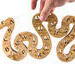 Hand-cut Alphabet Snake Puzzle made from premium hardwood, finished with mineral oil and beeswax for durability. Each of the 26 pieces represents a letter, promoting alphabet learning and essential skills development in kids through play.
