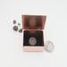photo of tiny trinket box with lid up and dime inside