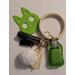 Green cat safety keychain with accessories
