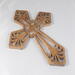 This Ten-Inch Rustic Fretwork Christian Cross Wall Hanging Art is handcrafted from reclaimed wood. Its intricate fretwork design adds unique texture and character, blending rustic charm with elegant design. It is a perfect focal point for any room.