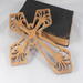 This Ten-Inch Rustic Fretwork Christian Cross Wall Hanging Art is handcrafted from reclaimed wood. Its intricate fretwork design adds unique texture and character, blending rustic charm with elegant design. It is a perfect focal point for any room.