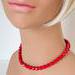 Lipstick red glass beaded choker, shown on a mannequin.