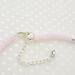 Silver plated clasp and extender chain, on a pink choker necklace.