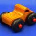 Handmade wooden toy pickup truck with extra large wheels, finished with amber shellac, black, and red paint from my Play Pal Collection.