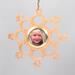 A handmade wood photo ornament featuring a hand-cut design and a customizable photo insert.