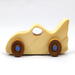 Handmade wooden toy bat car with a clear and amber shellac finish and metallic sapphire blue trim, part of my Play Pal Collection