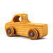 A handmade wooden pickup truck from the Play Pal Collection with an amber shellac finish and metallic sapphire blue acrylic paint.