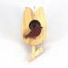 A wooden miniature birdhouse Christmas tree ornament shaped like a tulip, made from light beige wood, with a small dark reddish-brown bird perched at the entrance. It features a gold-colored hanging loop on top.