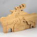 Handcrafted wood moose family stacking puzzle, ideal for children of all ages. Created in a traditional Toymakers Shop using woodworking tools, each piece is meticulously sanded and finished for lasting beauty and durability.