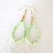 Green gemstone beaded dangle earrings, with gold crystal accents.