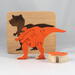 Handmade Wood Dinosaur Tray Puzzle with Amber Shellac and Orange Paint Finish. Freestanding and Versatile Toy for Kids of All Ages, Crafted in the USA with Traditional Woodworking Tools.