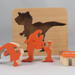 Handmade Wood Dinosaur Tray Puzzle with Amber Shellac and Orange Paint Finish. Freestanding and Versatile Toy for Kids of All Ages, Crafted in the USA with Traditional Woodworking Tools.