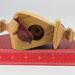 Handmade Wood Birdhouse Ornament Collectable Christmas Tree Ornament shapeed like a Christmas tree. Made from select-grade hardwoods, hand-sanded, and finished with a custom blend of oils and waxes using traditional woodworking tools.