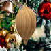 Handmade Wood Birdhouse Ornament Collectable Christmas Tree Ornament shapeed like a Christmas tree. Made from select-grade hardwoods, hand-sanded, and finished with a custom blend of oils and waxes using traditional woodworking tools.