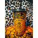 A 24oz matte cold cup in Black featuring the Spooky Doodle background in orange vinyl.  Leopard print background.