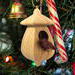 Handmade Wood Birdhouse Ornament Collectable Christmas Tree Ornament shapeed like a Christmas tree. Made from select-grade hardwoods, hand-sanded, and finished with a custom blend of oils and waxes using traditional woodworking tools.