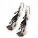 Black brass dangle earrings, with two tone blue and topaz glass and crystals.