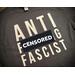 Black t-shirt with big block letters in white vinyl spelling out ANTI F****G FASCIST stacked on top of one another.