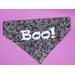 Black over-the-collar pet bandana with white swirl pattern and "Boo!" saying in white flock material.