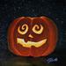 Photo of small square canvas painting of glowing jack o'lantern pumpkin with swirling eyes and a starry sky in the background