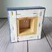 Photo of back of small square canvas
