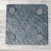 Backside of coaster with rubber pads