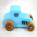 This handmade wooden toy car, modeled after a 1927 Ford T-Coupe, is hand-painted baby blue with black and metallic sapphire blue. The wheels are finished with nonmarring amber shellac.