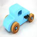 This handmade wooden toy car, modeled after a 1927 Ford T-Coupe, is hand-painted baby blue with black and metallic sapphire blue. The wheels are finished with nonmarring amber shellac.