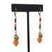 Skull dangle earrings, with orange glass beads.