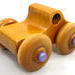 Handmade wood toy monster pickup truck from the Play Pal Collection, featuring a stunning finish of amber shellac and metallic purple trim. Crafted in the USA using traditional woodworking tools and techniques, this eye-catching toy truck is built to last.


Carefully assembled and tested for the highest quality, it's designed for kids to play with. The large wheels ensure smooth rolling on various surfaces, and its sturdy build can withstand rough play, making it a durable and enjoyable addition to any child's collection.