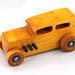 Handcrafted wooden hot rod toy car modeled after a classic '32 sedan. Finished with amber shellac and adorned with metallic sapphire blue and black trim. This unique piece is part of my Hot Rod Collection.