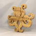 A handcrafted octopus puzzle made from wood. The puzzle is freestanding and can comfortably sit on a shelf, table, window sill, or door frame.