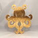 A handcrafted octopus puzzle made from wood. The puzzle is freestanding and can comfortably sit on a shelf, table, window sill, or door frame.