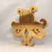 A handcrafted octopus puzzle made from wood. The puzzle is freestanding and can comfortably sit on a shelf, table, window sill, or door frame.