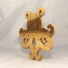 A handcrafted octopus puzzle made from wood. The puzzle is freestanding and can comfortably sit on a shelf, table, window sill, or door frame.