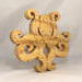 A handcrafted octopus puzzle made from wood. The puzzle is freestanding and can comfortably sit on a shelf, table, window sill, or door frame.