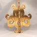 A handcrafted octopus puzzle made from wood. The puzzle is freestanding and can comfortably sit on a shelf, table, window sill, or door frame.