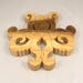 A handcrafted octopus puzzle made from wood. The puzzle is freestanding and can comfortably sit on a shelf, table, window sill, or door frame.