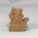 Handmade wood toy kitten cutout made from unfinished wood. It is sanded and ready to paint. It is a freestanding and excellent pretend toy that can also be used for crafts.