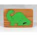 Handmade three-piece wooden dinosaur tray puzzle finished with amber shellac and green acrylic paint.