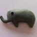 hand sewn pocket sized green stuffed elephant