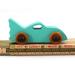 Handmade wooden toy car painted green with black trim and nonmarring amber shellac finished wheels, Part of my Play Pal Collection.