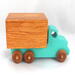 This handmade wooden toy truck is a box truck or moving van, painted in your choice of several colors. The wheels and body of the truck are finished with shellac.