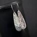 Hammered long sterling silver teardrop earrings by MariesGems.