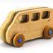 Handmade wood toy minivan made by me in my shop using traditional woodworking tools. It is hand finished with clear shellac with metallic sapphire blue acrylic paint.