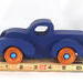 Toy Pickup Truck With Fat Fenders HanA handmade wooden toy pickup truck with large fenders, painted in nontoxic navy blue and metallic sapphire blue and finished with non-marring amber shellac on the wheels.dmade and Painted Navy Blue