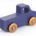 Handmade wooden toy pickup truck handmade and painted navy blue with amber shellac wheels and metallic sapphire blue trim. It's a little blue truck from my Play Pal Collection.